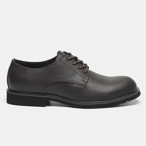 Detailed side view of dark brown leather shoe showing fine stitching and thick sole