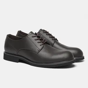 Detailed side view of dark brown leather men's oxford dress shoes with black soles