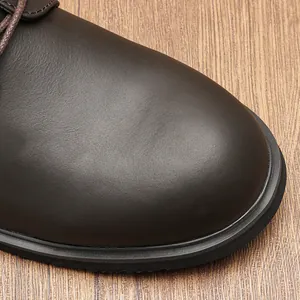 Close-up macro detail of premium matte brown cowhide leather on men's casual work shoe