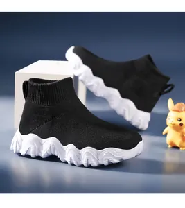 Breathable black kids high-top flyknit sock sneakers featuring a wavy white thick sole