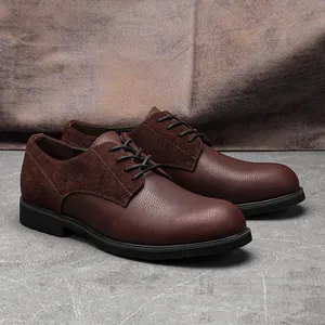 Close-up detail of men's dark brown genuine leather dress shoes with suede paneling