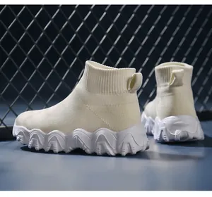 Detailed close-up of children's white high-top breathable fly-knit sports sock sneakers