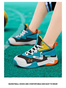 Close-up detail of breathable mesh boys' basketball shoes on a green court background