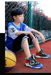 Boys professional breathable basketball shoes with non-slip mesh on a basketball court
