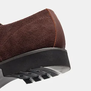 Macro shot of premium brown suede leather shoe heel with durable non-slip rubber sole