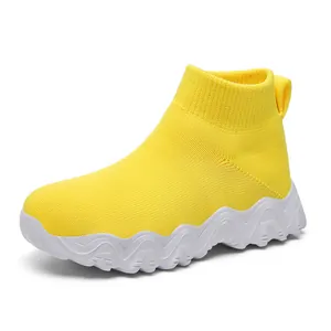 Bright yellow breathable knit sock sneakers for kids with chunky wavy white soles