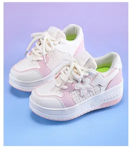 Detailed view of pink and white girls' roller shoes with elegant woven texture design