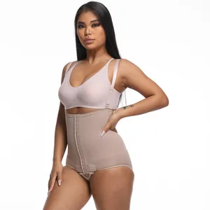 Close-up of high-waist tummy control shapewear with hook-and-eye closure on model.
