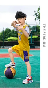 Detail view of boys breathable mesh basketball shoes on a child model at a court