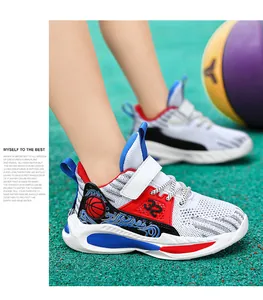 Close-up of breathable mesh boys basketball shoes worn on a sports court setting