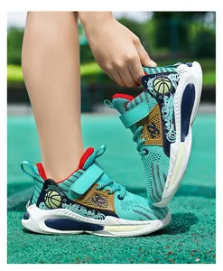Breathable teal boys' basketball shoes featuring mesh upper and unique basketball pattern.