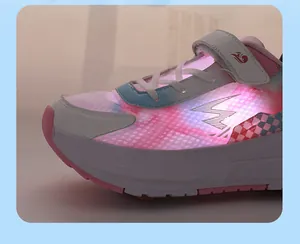 Detailed close-up showing vibrant LED light effects on pink and white kids roller shoes