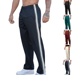 Men's loose sports trousers featuring white side stripes in multiple color options.