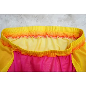 Close-up of vibrant gradient mesh skirt waistband showing elastic detail and stitching