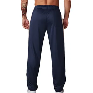 Detailed back view of men's navy blue sports pants featuring side stripes and loose fit.