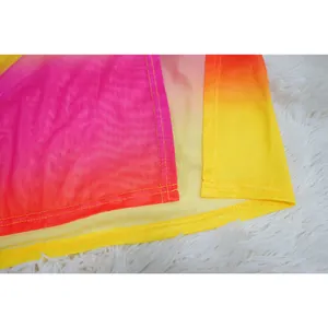 Close-up detail showing the vibrant gradient mesh fabric with fine yellow stitching seams.