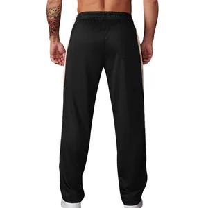 Back view of black men's loose fitting sports pants with contrast side stripes