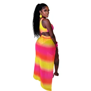 Detail view of pink and yellow ombré mesh two-piece set with bodysuit and slit skirt