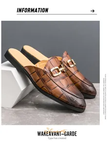 Close-up detail of stylish brown crocodile pattern leather mules with gold buckle accents