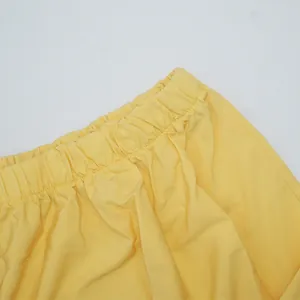 Detail view of the high-quality elastic waistband on a summer yellow plus size dress