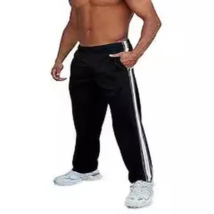 Black men's loose straight-leg athletic pants with white side stripes shown on model