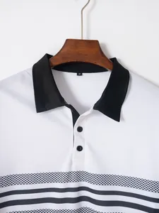 Close-up detail showing the black collar and striped print on this white men's polo shirt