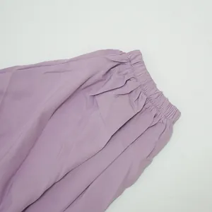 Detailed view of the elasticated waistband on purple pleated summer dress for women