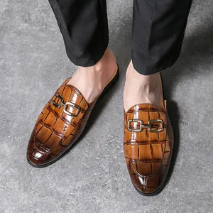 Men's brown crocodile-patterned leather mules with gold metal buckle detail