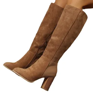Elegant women's brown suede knee-high boots featuring a chunky heel and side zipper closure