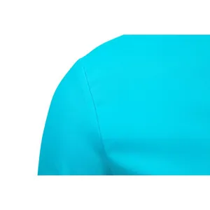 Macro close-up view of durable shoulder seam on cyan formal business shirt for men