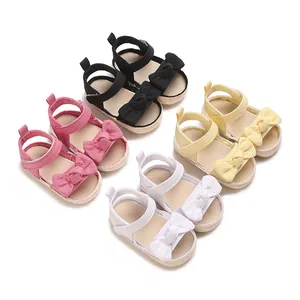 Sandalias de verano para bebé niña con lazo, puntera abierta y detalle de suela tejida