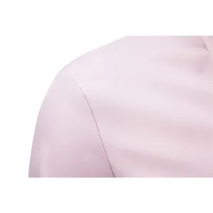 Close-up of pink business shirt shoulder and collar detail showing stitching