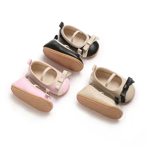 Set of soft-soled baby girl princess shoes in pink, black, and beige with bow details
