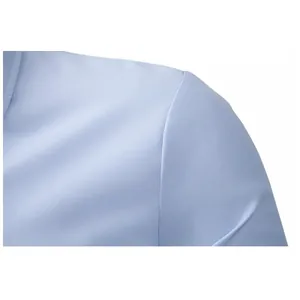 Macro view of shoulder stitching and fine fabric texture on a light blue dress shirt
