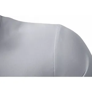 Close-up of shoulder seam and fabric texture on a grey men's business dress shirt.