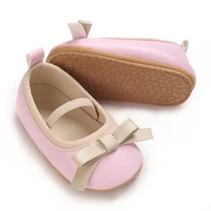 Detailed view of pink baby girl princess sandals with cute bow and non-slip rubber sole
