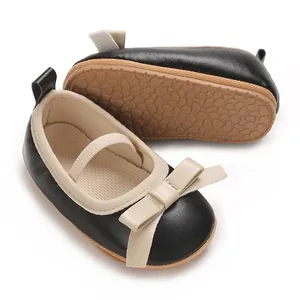 Close-up detail of baby girl princess sandals with cute bow and non-slip rubber sole