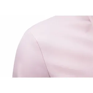 Detailed macro view of high-quality shoulder stitching and fabric on pink business shirt