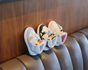 Details of stylish high-top kids' sneakers in blue, black, and pink colorways