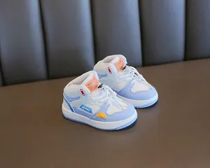 Detailed view of stylish color-block children's high-top sneakers with soft anti-slip soles