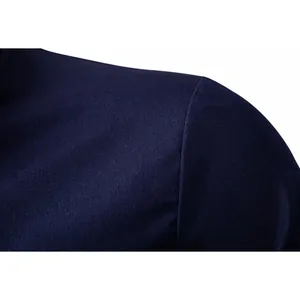 Close-up detail of the shoulder seam and texture on a navy blue men's formal shirt