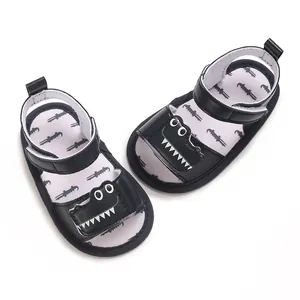 Close-up of baby walking sandals with cute cartoon crocodile design and soft soles
