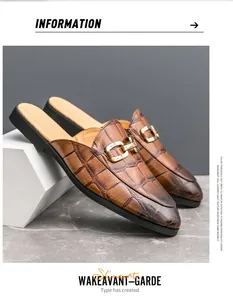 Detailed side view of men's brown crocodile embossed backless loafers with gold buckle