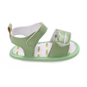 Side view of cute green baby crocodile sandals with soft cartoon pattern insoles