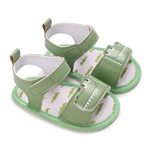 Detailed view of green soft sole baby walking sandals with cute cartoon crocodile design