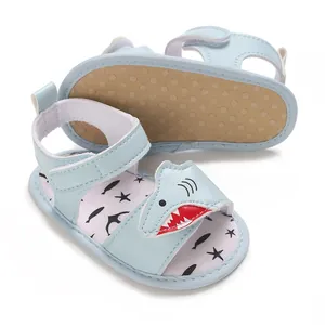 Detail showing soft sole and cartoon shark design on baby summer sandals.