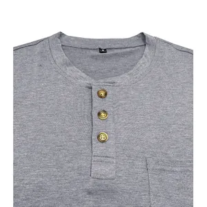 Detailed view of grey Henley t-shirt collar with three buttons and chest pocket