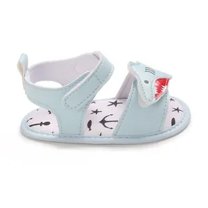 Detailed close-up of light blue baby shark cartoon sandals with soft walking sole
