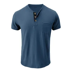 Detail of men's slim-fit blue Henley shirt featuring a chest pocket and buttons
