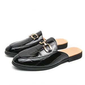 Elegant black crocodile texture men's closed-toe mules with stylish gold buckle detail